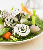 Rolled chicken breasts with herbs,spring vegetables