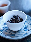 Tea leaves in a small bowl