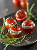 Cherry tomatoes stuffed with cream cheese and herbs