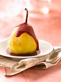Poached pear with summer fruit puree