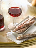 Mini dried sausages with a glass of red wine