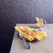 Rolled hazelnut crepes with toffee sauce