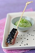 Tuna sushi with sesame seeds,cream of avocado with herbs and Tabasco
