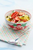 Strawberry and yellow kiwi fruit salad