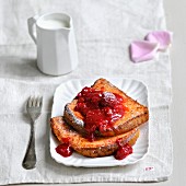 Pink biscuit french toast with stewed summer fruit