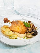 Roast duck with mushrooms and potatoes