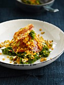 Green cabbage with lentils and fried bacon
