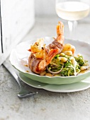 White beans with chicory and shrimps wrapped in crisp bacon