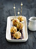 Foie gras balls coated in crushed almonds with chocolate