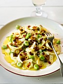 Thinly sliced fennel with broad beans, olives and capers