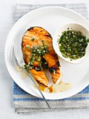 Grilled salmon steak with green salsa