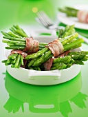 Bundles of green beans attached with streaky bacon