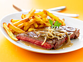 Rare steak with french fries