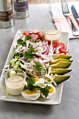 Dish of raw vegetables and hard boiled eggs