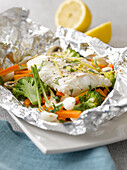 Cod and vegetables cooked in aluminium foil