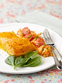 Spicy steamed trout with orange lentils
