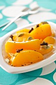 Peach fruit salad with cloces and cardamom