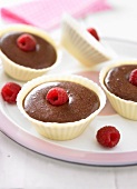 Chocolate mousse and raspberries in white chocolate casings
