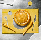 Flaky pastry pie and knife and fork