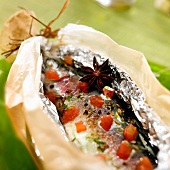 Spicy trout cooked in aluminium foil and wax paper