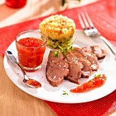 Sliced duck breast,tomato jam,small zucchini gratin