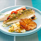 Pike-perch fillet with tomatoes and olives, sauteed potatoes and spring onions