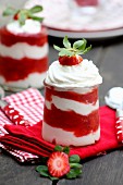 A layered dessert with strawberries and cream