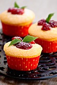 Raspberry cupcakes in paper cases