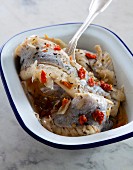 Marinated herring with chilli peppers