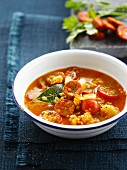 Orange lentil, tomato and chorizo soup