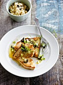 Grilled swordfish with spring onions and olives