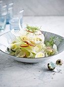 Crisp fennel, apple and radish salad with quail's eggs