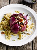 Red onions stuffed with sun-dried tomatoes and feta,bulghour