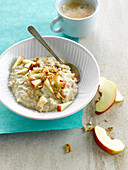 Porridge with sliced apple and crushed walnuts