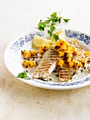 Grilled tilapia with diced mango and black and white rice