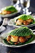 Scallops and chestnuts in cabbage leaves