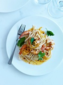 Pasta with shrimps marinated in hot red pepper and lemon zests