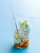 Papaya with crushed meringues and lime syrup