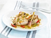 Cod in garlic sauce with lemon, lime and red peppers