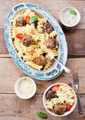 Pasta with beef meatballs and sesame seeds