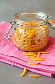Jar of uncooked macaronis