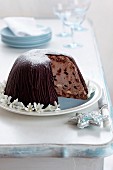 Christmas pudding with chocolate ice cream and dried fruit