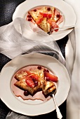 Crepes with grapefruit, redcurrants and orange zests
