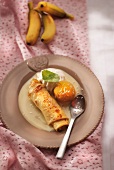Crepe and banana roll with custard and mango ice cream