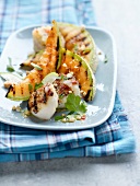 Roasted scallops and sliced melon
