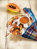 Shrimp and banana brochettes with papaya and red pepper Creole sauce