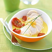 Chicken inlemon sauce with confit tomatoes
