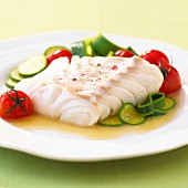 Fillet of cod with zucchinis and tomatoes