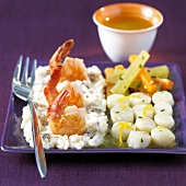 Risotto with king prawns,carrots and salsifies with orange sauce