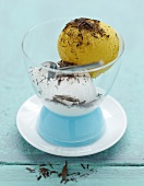 Coconut and mango scoops of ice cream with chocolate flakes